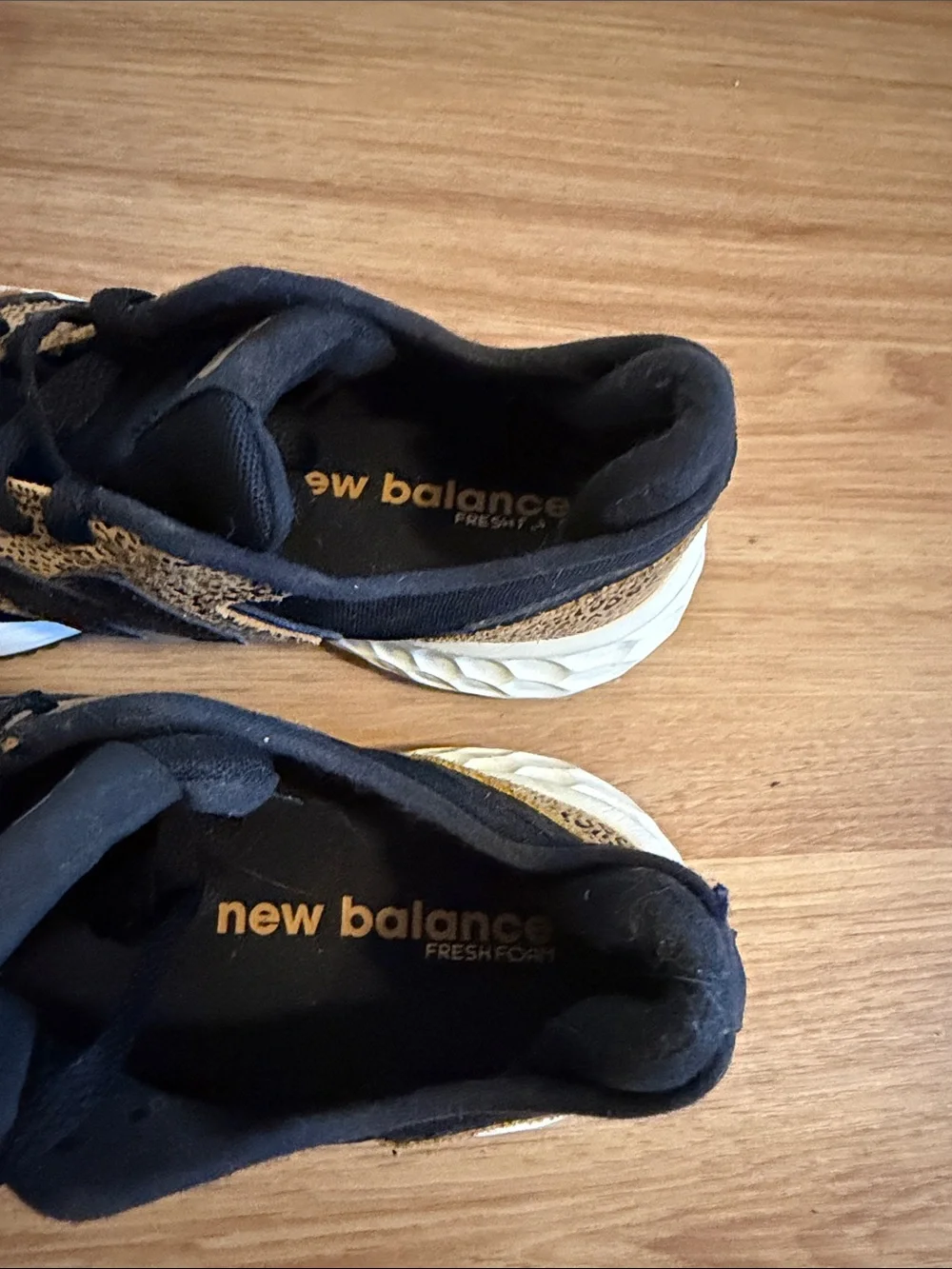 New Balance women’s Black and Tan Leopard-Print Sneakers